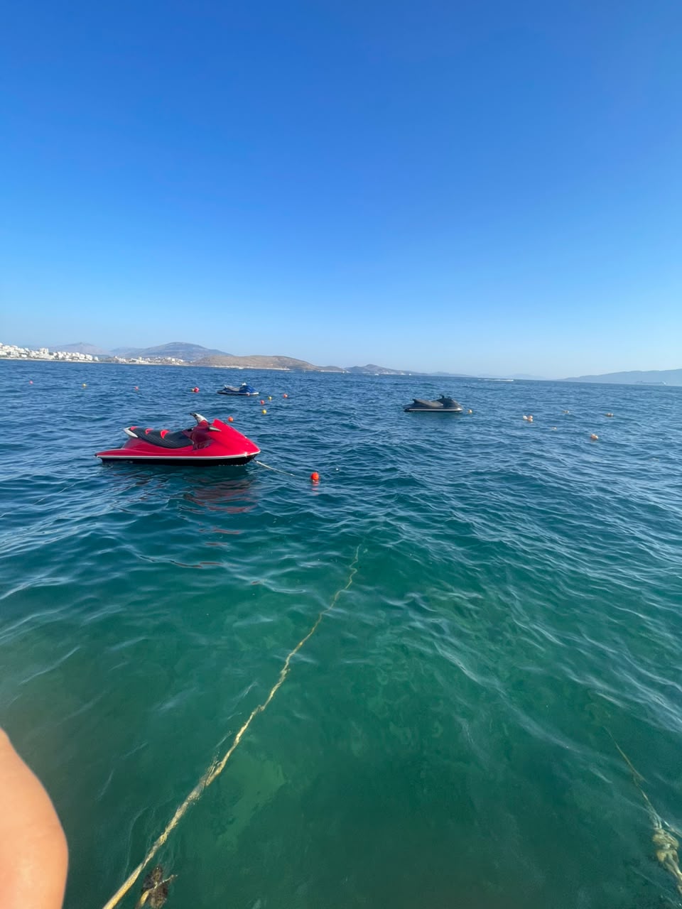 Jet skis lined up on the RentJetskiMichael dock in Sarandë